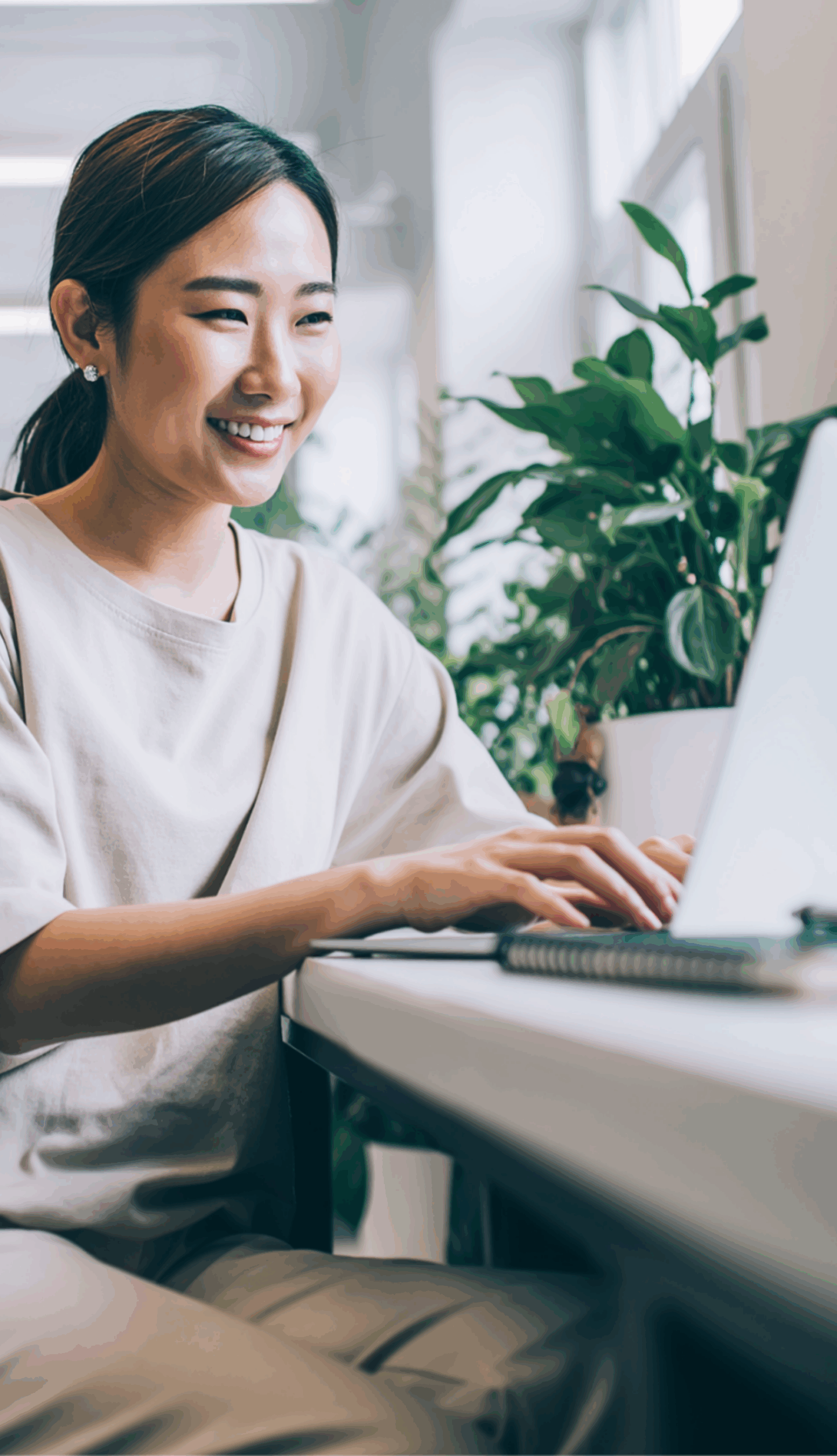 woman with laptop smiling