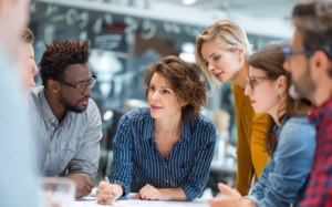 Diverse team collaborating in a modern office meeting