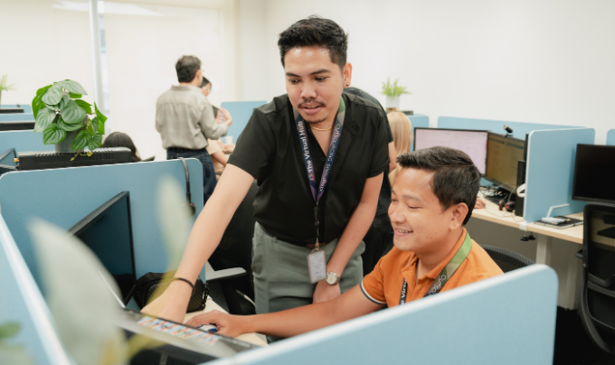 The Virtual Hub team members collaborating at a computer